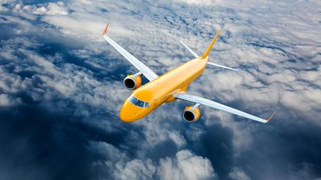 Vibrant Yellow Airplane Soaring Above Clouds 5K Wallpaper wallpaper