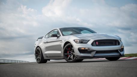 Sleek Silver Mustang on the Track wallpaper