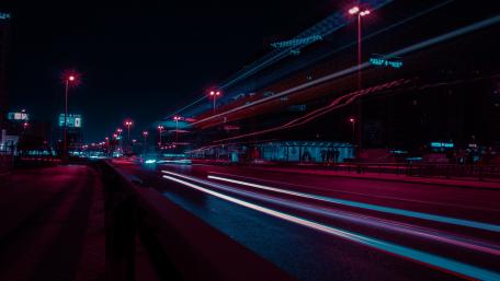 Vibrant Night Cityscape with Light Trails wallpaper