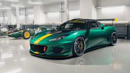 Ultimate Lotus Evora in a Pristine Garage Setting wallpaper