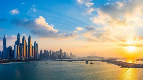 Stunning Cityscape at Sunset Over Water wallpaper