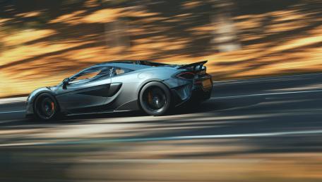Sleek McLaren in Motion Capturing Speed and Power wallpaper