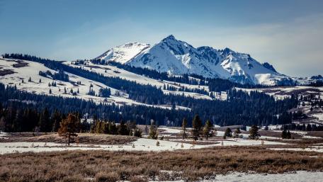 Majestic Snow-Capped Mountains in Winter Wonderland wallpaper