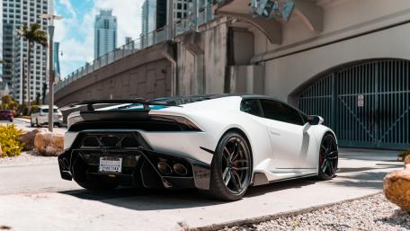 Sleek White Lamborghini in Urban Setting wallpaper