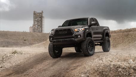 Powerful Toyota Pickup Truck on Rugged Terrain wallpaper