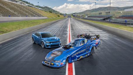 Speed Meets Power on the Race Track wallpaper