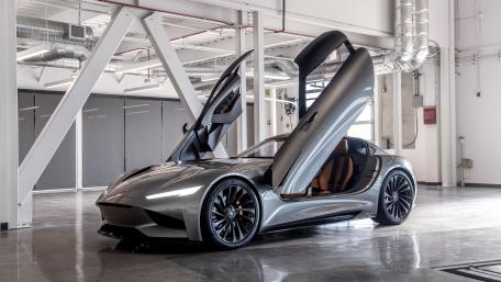 Sleek Supercar with Stylish Doors Up wallpaper