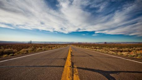Endless Journey Along Scenic Open Road wallpaper