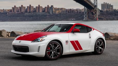 Sleek Sport Car by the Riverfront wallpaper