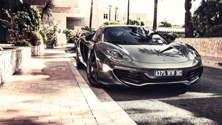 Sleek Dream Car in a Tropical Paradise wallpaper