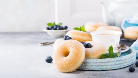 Sweet Delight of Donuts with Berries and Tea wallpaper