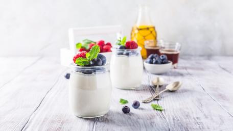 Delicious Yogurt with Fresh Berries and Mint Sprigs wallpaper