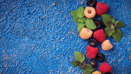 Vibrant Berry Medley on Textured Background wallpaper