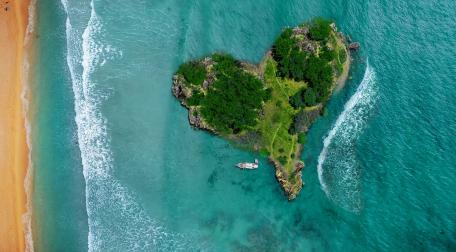 Heart-Shaped Island Embraced by Serene Waters wallpaper