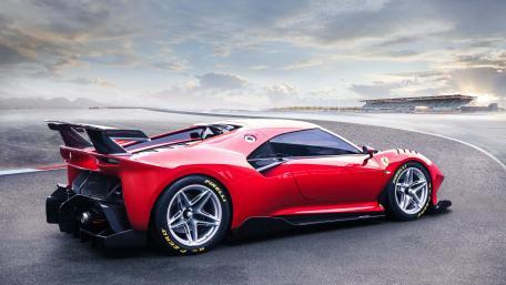 Dreamy Red Ferrari Racing on the Track wallpaper