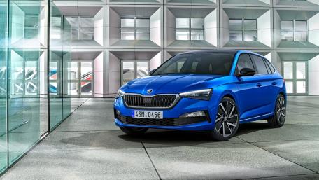 Sleek Blue Car in Modern Architecture wallpaper