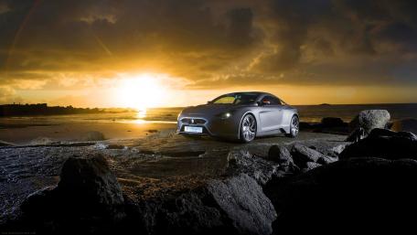 Dream Car by the Shoreline at Sunset wallpaper
