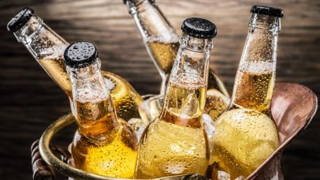Refreshing Bottles of Beer in a Chilled Bucket wallpaper