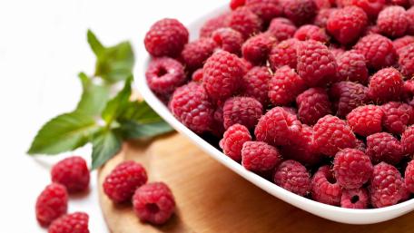 Fresh and Juicy Raspberries in a Bowl wallpaper