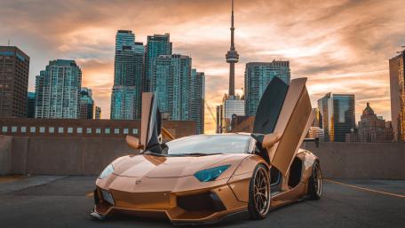 Stunning Luxury Car at Sunset Viewpoint wallpaper
