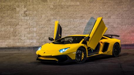 Sleek Yellow Lamborghini with Open Doors Enhance Your Space wallpaper