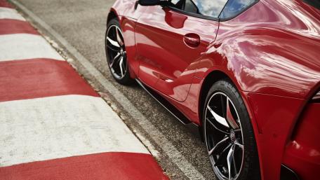 Sleek Red Sports Car on the Track wallpaper