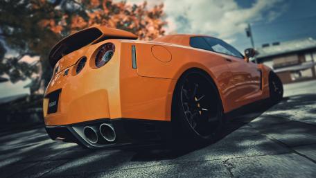Vibrant Orange Nismo Car Wallpaper wallpaper