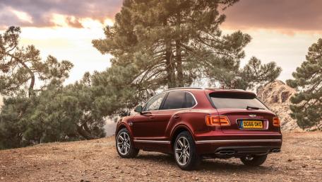 Luxury SUV in a Scenic Landscape wallpaper
