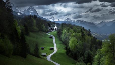 Serene Mountain Landscape with Rolling Hills and Villages wallpaper