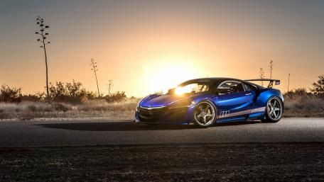 Stunning Blue Sports Car at Sunset wallpaper