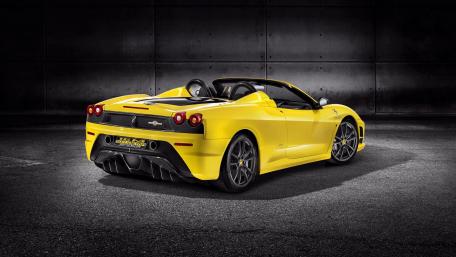 Vibrant Yellow Sportscar on Display wallpaper