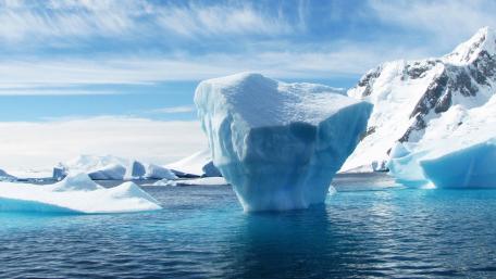 Majestic Iceberg in Crystal Blue Waters wallpaper