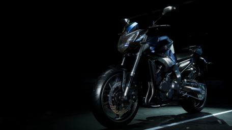 Sleek Motorcycle in Dim Lighting Showcase wallpaper