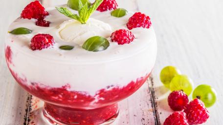 Delicious Raspberry Dessert Bowl with Mint Garnish wallpaper