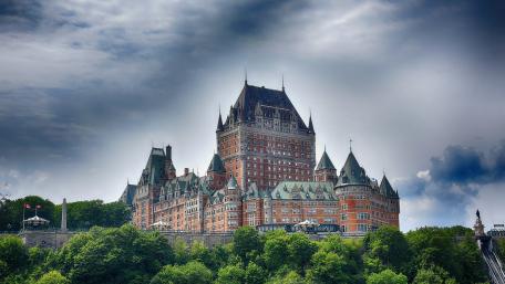 Majestic Castle Amidst Dramatic Skies wallpaper