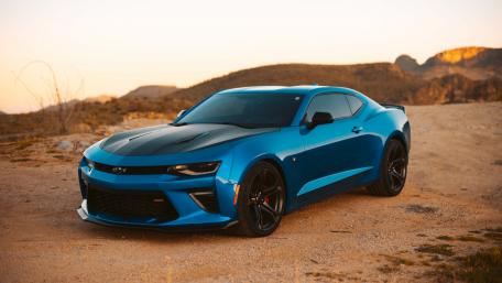 Sleek Blue Camaro in a Desert Landscape wallpaper