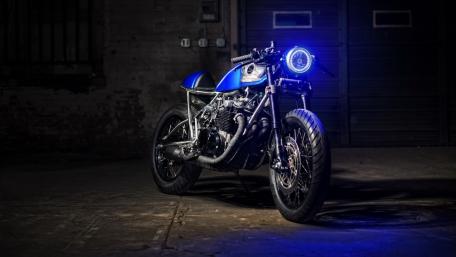 Sleek Blue Motorcycle in Urban Setting wallpaper