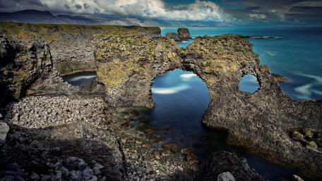 Majestic Coastal Rock Formation Enhancing Nature's Beauty wallpaper