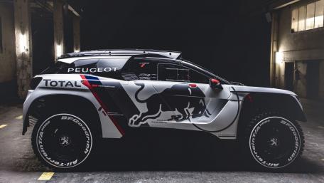Dynamic Peugeot Racing in Urban Setting wallpaper