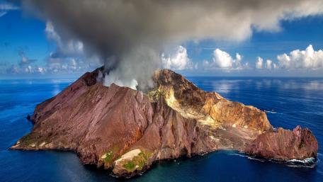 Majestic Volcano Overlooking the Ocean wallpaper