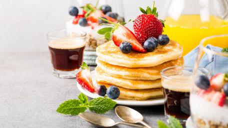 Delicious Pancakes with Fresh Berries and Syrup wallpaper