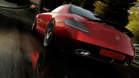 Sleek Red Sports Car on a Scenic Drive wallpaper