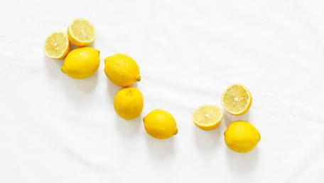 Vibrant Lemons on White Background wallpaper