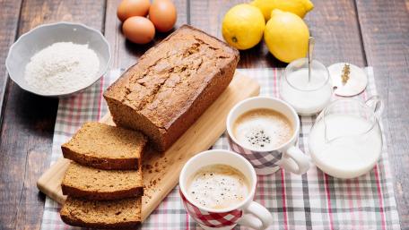 Warm and Cozy Kitchen Setup with Freshly Baked Bread wallpaper