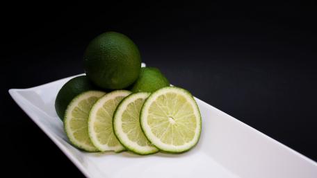 Fresh Lime Slices on a Plate wallpaper