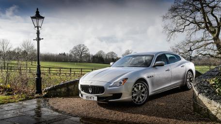 Elegant Silver Maserati in Scenic Landscape wallpaper