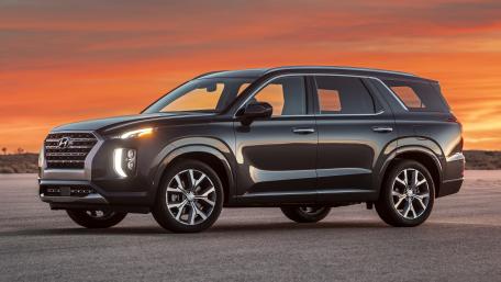 Sleek Hyundai SUV Against a Stunning Sunset Background wallpaper
