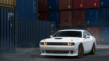 Sleek White Muscle Car in Urban Setting wallpaper