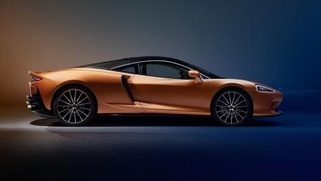 Sleek McLaren Sports Car in Striking Orange Finish wallpaper