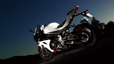 Sleek Sports Motorcycle against a Dusk Sky wallpaper